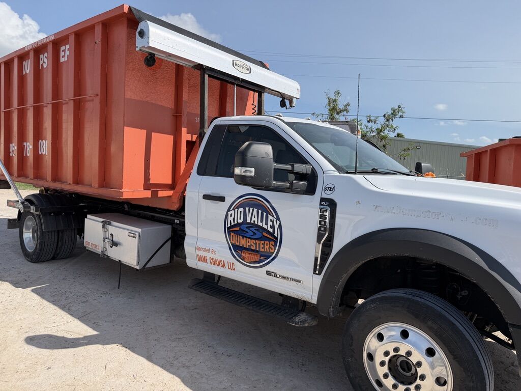 Rio Valley Dumpsters roll-off dumpster truck loaded and ready for delivery in South Texas